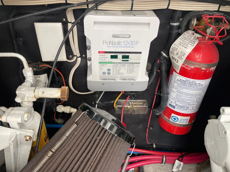 Slide: The Image of Electrical panel and fire extinguisher in 2000 Wellcraft 330 Coastal boat engine room. - 22