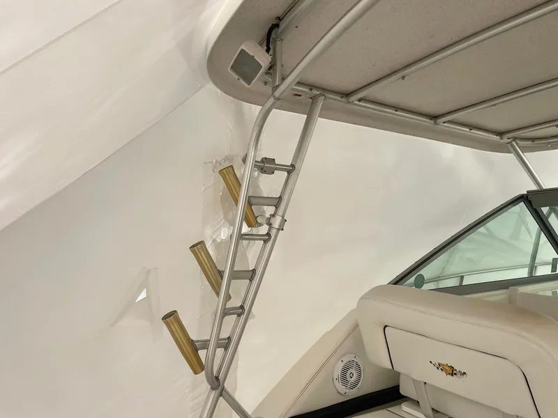 Slide: The Image of Wellcraft 330 Coastal 2000 boat interior with ladder and seating. - 9