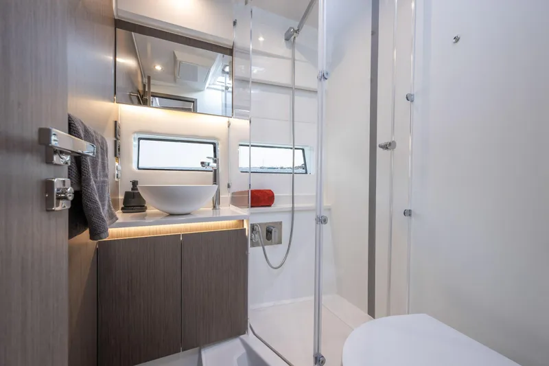 Slide: The Image of Modern bathroom interior of 2025 Jeanneau NC 1295 Coupe yacht, featuring sleek design and fixtures. - 12