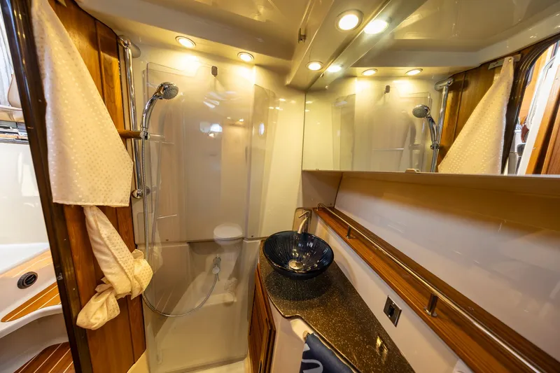 Slide: The Image of Luxurious bathroom in 2023 Ranger Tugs R-31 S boat with modern fixtures. - 27