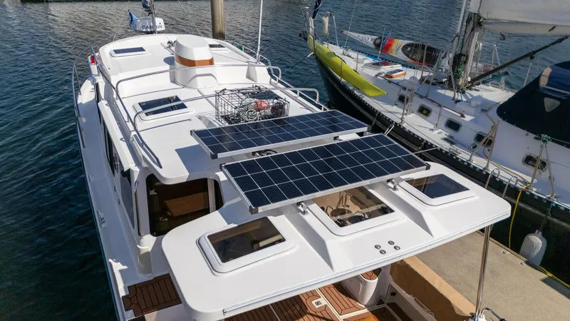 Slide: The Image of 2023 Ranger Tugs R-31 S with solar panels docked at marina. - 34