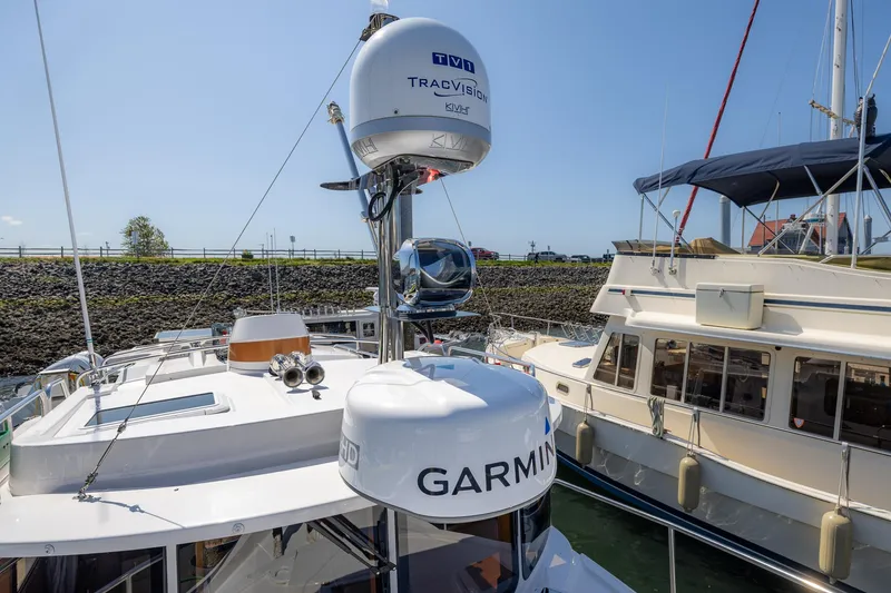 Slide: The Image of 2023 Ranger Tugs R-31 S boat with Garmin and TracVision equipment docked in marina. - 37