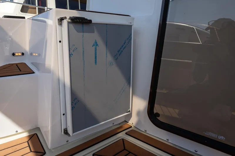 Slide: The Image of 2023 Ranger Tugs R-31 S boat interior with a closed storage compartment. - 5