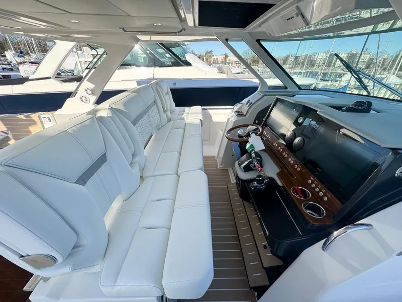 Slide: The Image of Luxurious interior of 2025 Tiara Yachts 43 LS with plush seating and modern helm. - 16