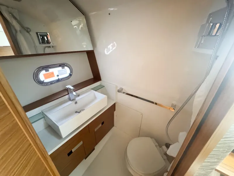 Slide: The Image of Luxurious bathroom in 2025 Tiara Yachts 43 LS, featuring modern sink and toilet. - 20
