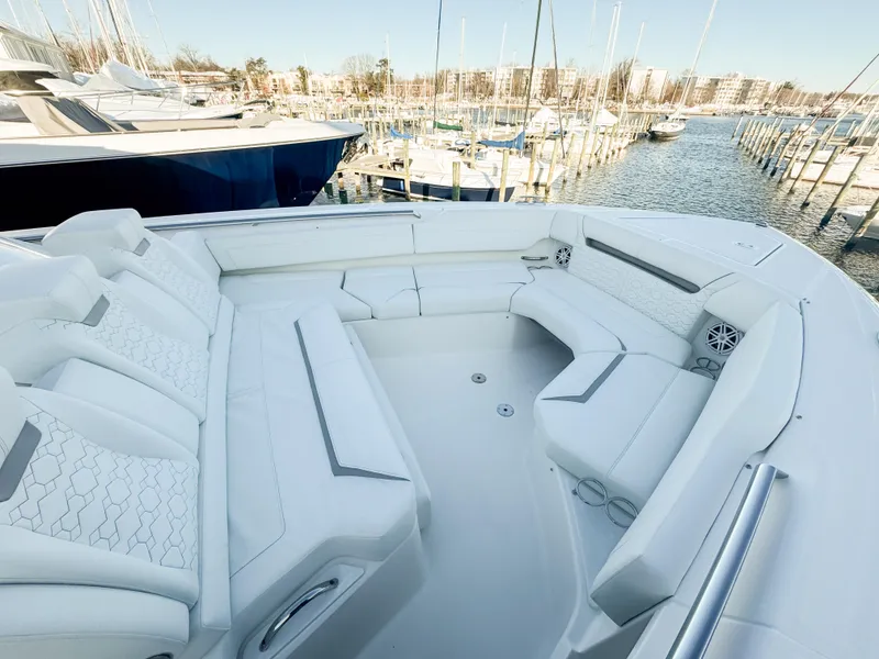 Slide: The Image of Luxurious 2025 Tiara Yachts 43 LS with spacious seating at a marina. - 22