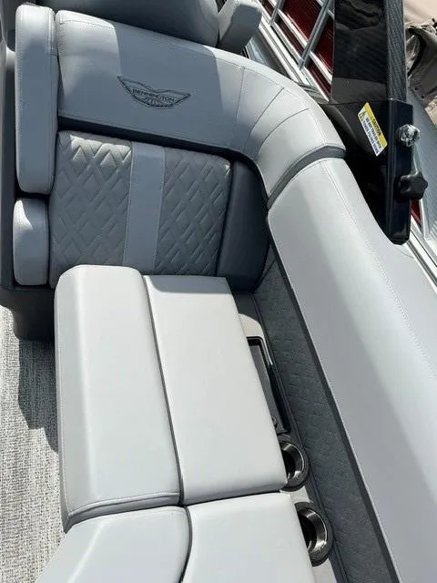 Slide: The Image of 2025 Bennington 26 MFB boat interior with luxurious gray seating and diamond stitching. - 3