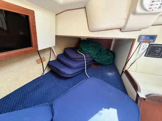 Slide: The Image of Interior cabin of 1983 Pearson 303 sailboat with cushions and storage. - 30