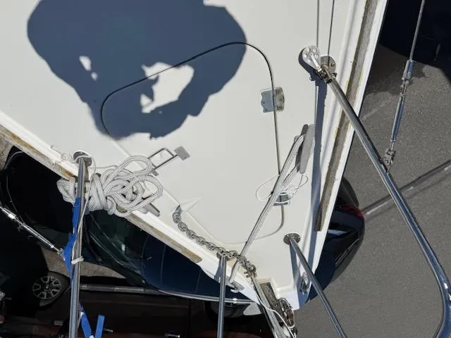Slide: The Image of Overhead view of 1983 Pearson 303 sailboat deck with ropes and shadow. - 33