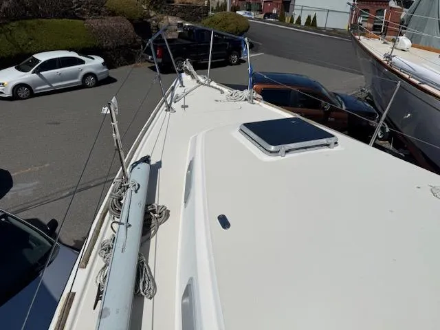 Slide: The Image of 1983 Pearson 303 sailboat deck view in a parking lot. - 34