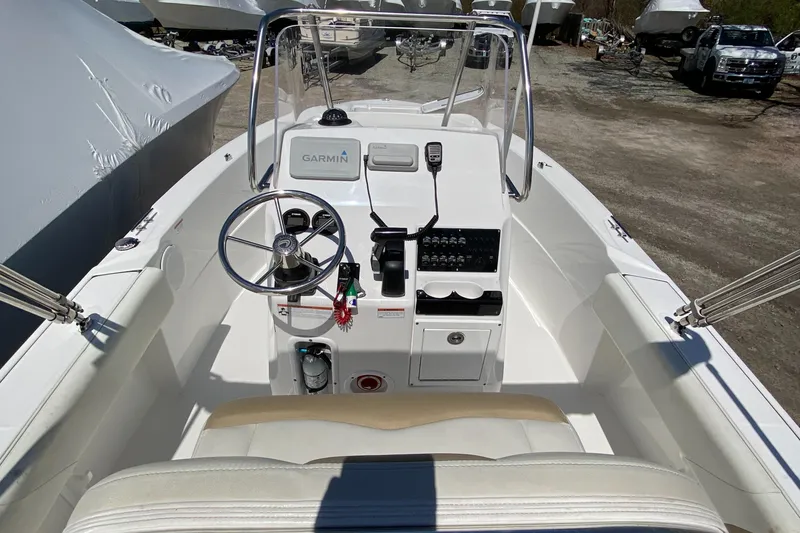 Slide: The Image of 2020 Edgewater 188CC boat interior with steering wheel and Garmin navigation system. - 10
