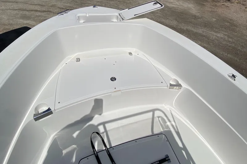 Slide: The Image of 2020 Edgewater 188CC boat interior with open storage compartment, showcasing sleek white design. - 14
