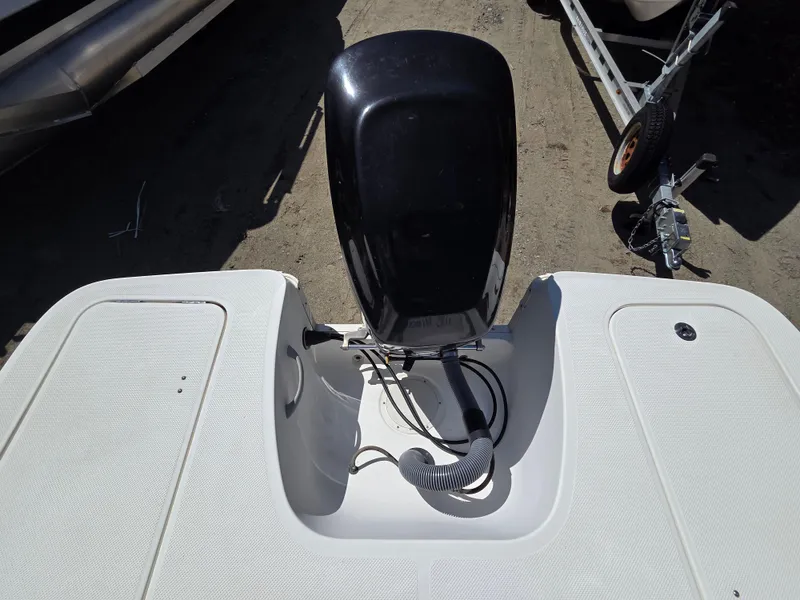 Slide: The Image of 2007 Bayliner 217 Deck Boat with outboard motor, viewed from above. - 4