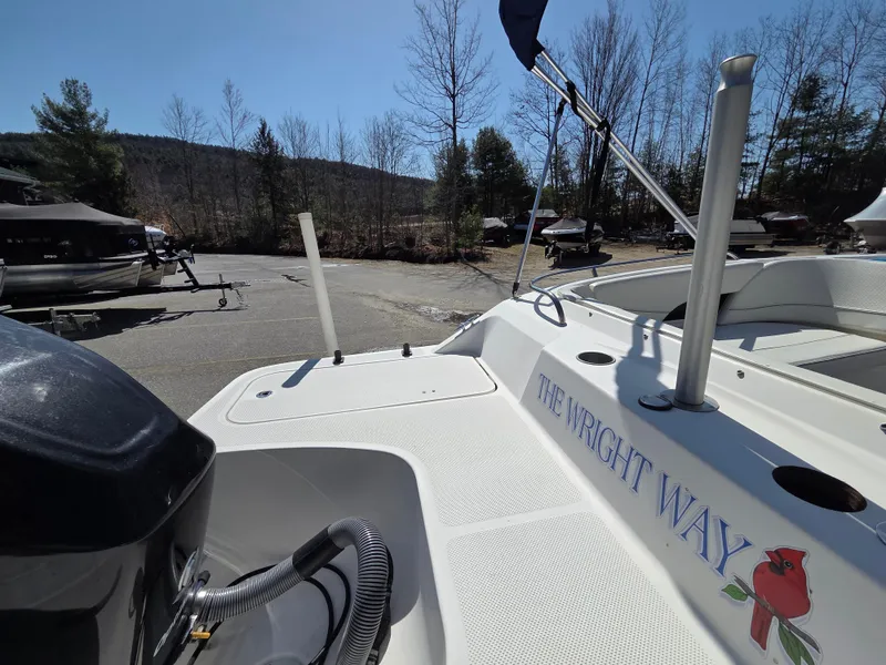 Slide: The Image of 2007 Bayliner 217 Deck Boat docked, featuring "The Wright Way" text on the side. - 5