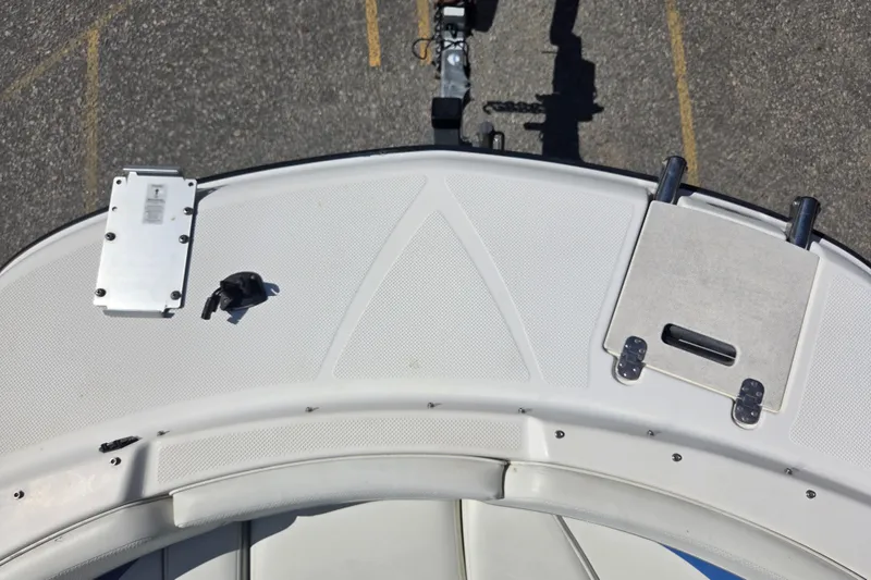 Slide: The Image of 2007 Bayliner 217 Deck Boat bow view with seating and deck features. - 8