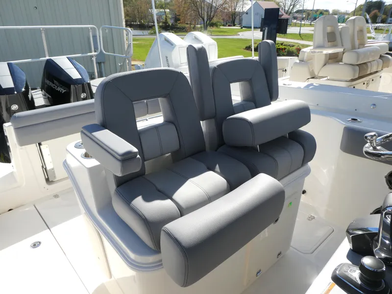 Slide: The Image of 2025 Boston Whaler 280 Outrage boat with luxurious gray seating and modern design. - 10