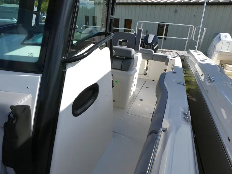 Slide: The Image of 2025 Boston Whaler 280 Outrage boat interior, featuring seating and sleek design. - 15