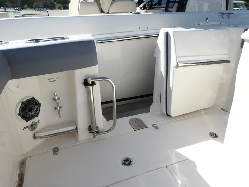 Slide: The Image of 2025 Boston Whaler 280 Outrage boat interior, featuring sleek white design and modern amenities. - 6