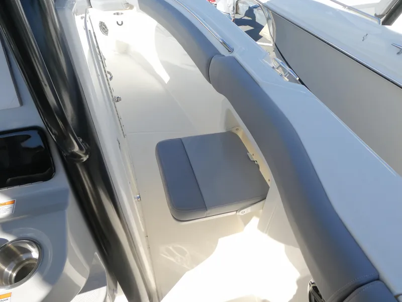 Slide: The Image of 2025 Boston Whaler 280 Outrage interior with cushioned seating and sleek design. - 9