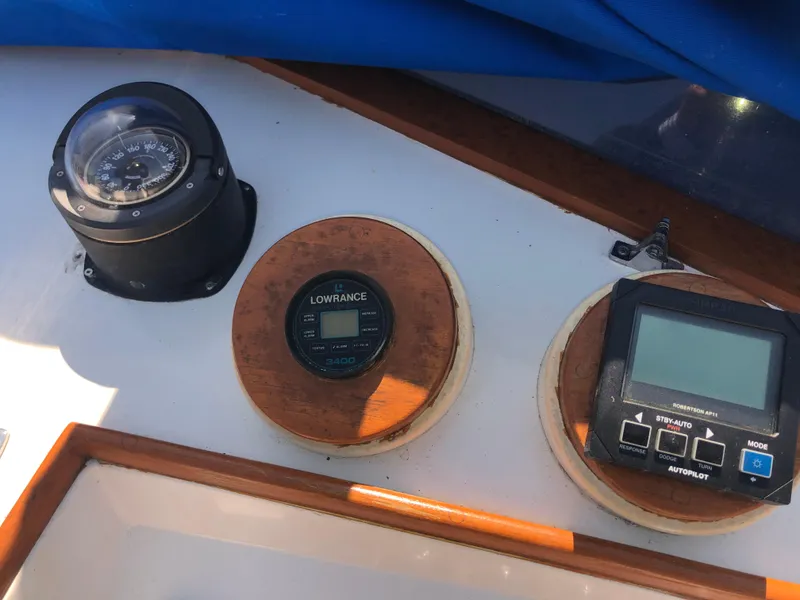 Slide: The Image of Navigation instruments on a 1976 Grand Banks 42 Classic boat dashboard. - 16