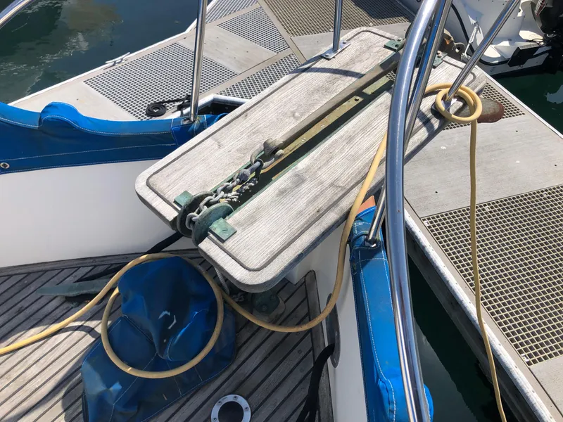 Slide: The Image of 1976 Grand Banks 42 Classic deck with anchor chain and mooring lines. - 22