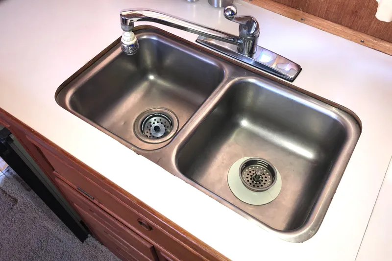 Slide: The Image of Double stainless steel sink in 1976 Grand Banks 42 Classic yacht kitchen. - 31