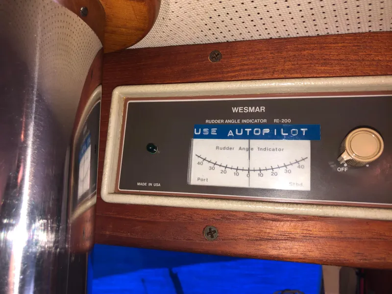 Slide: The Image of Rudder angle indicator on 1976 Grand Banks 42 Classic boat dashboard. - 41