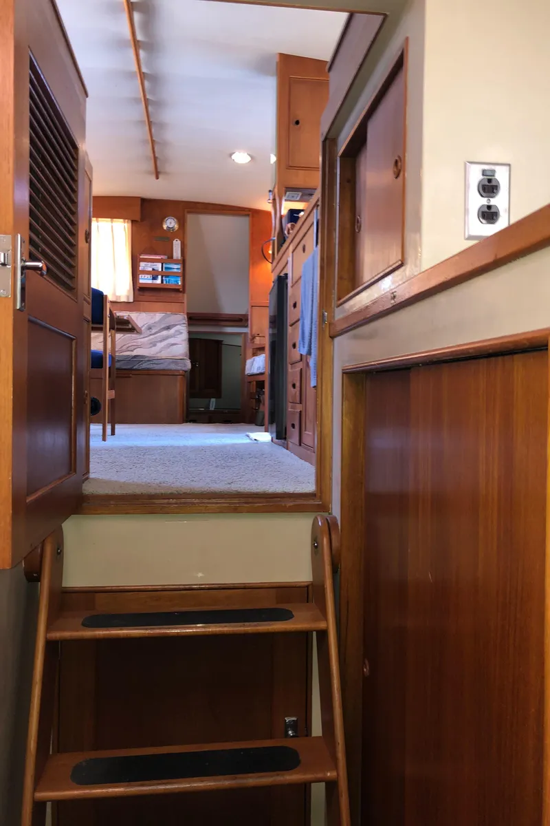 Slide: The Image of Interior of 1976 Grand Banks 42 Classic yacht with wooden stairs and cozy cabin. - 47