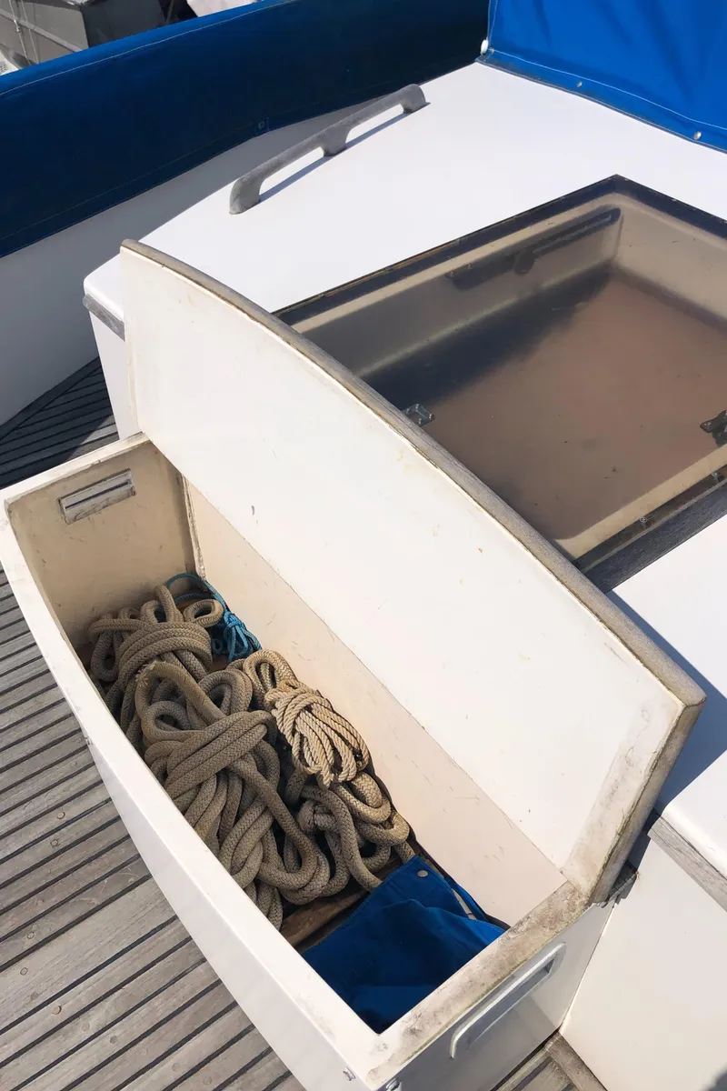 Slide: The Image of Storage compartment with ropes on a 1976 Grand Banks 42 Classic boat deck. - 5