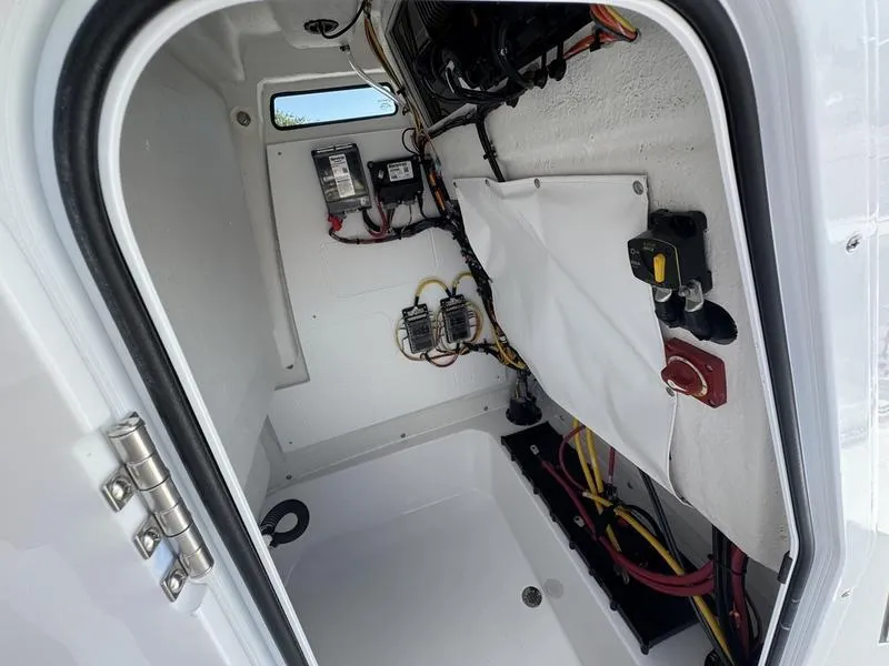 Slide: The Image of 2025 Sportsman Open 212 boat interior wiring and electrical components. - 17