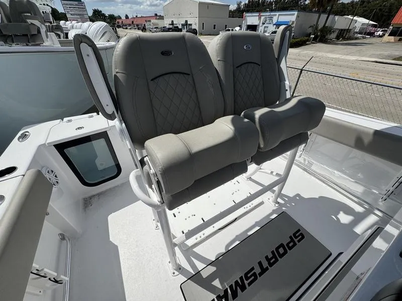 Slide: The Image of 2025 Sportsman Open 212 boat with dual cushioned seats and sleek design. - 19