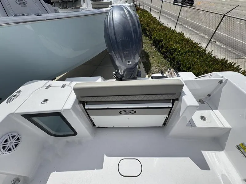 Slide: The Image of 2025 Sportsman Open 212 boat interior with seating and outboard motor. - 25