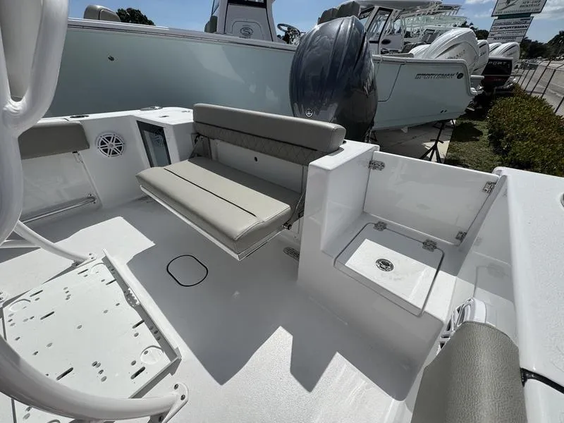 Slide: The Image of 2025 Sportsman Open 212 boat interior with seating and storage compartments. - 26