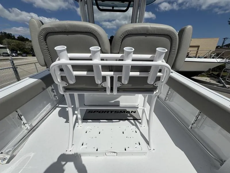 Slide: The Image of 2025 Sportsman Open 212 boat interior with rod holders and seating. - 27