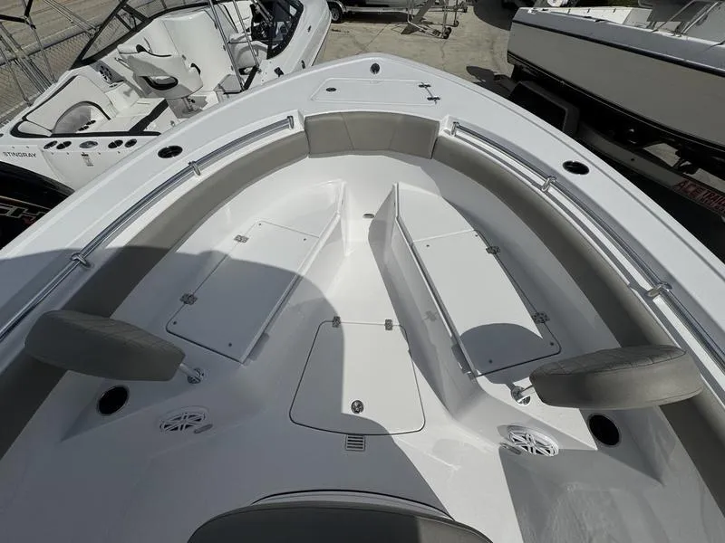 Slide: The Image of 2025 Sportsman Open 212 boat interior with seating and storage compartments. - 5