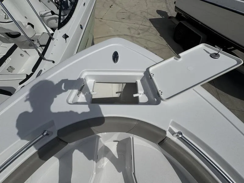 Slide: The Image of 2025 Sportsman Open 212 boat with open storage compartment on deck. - 6