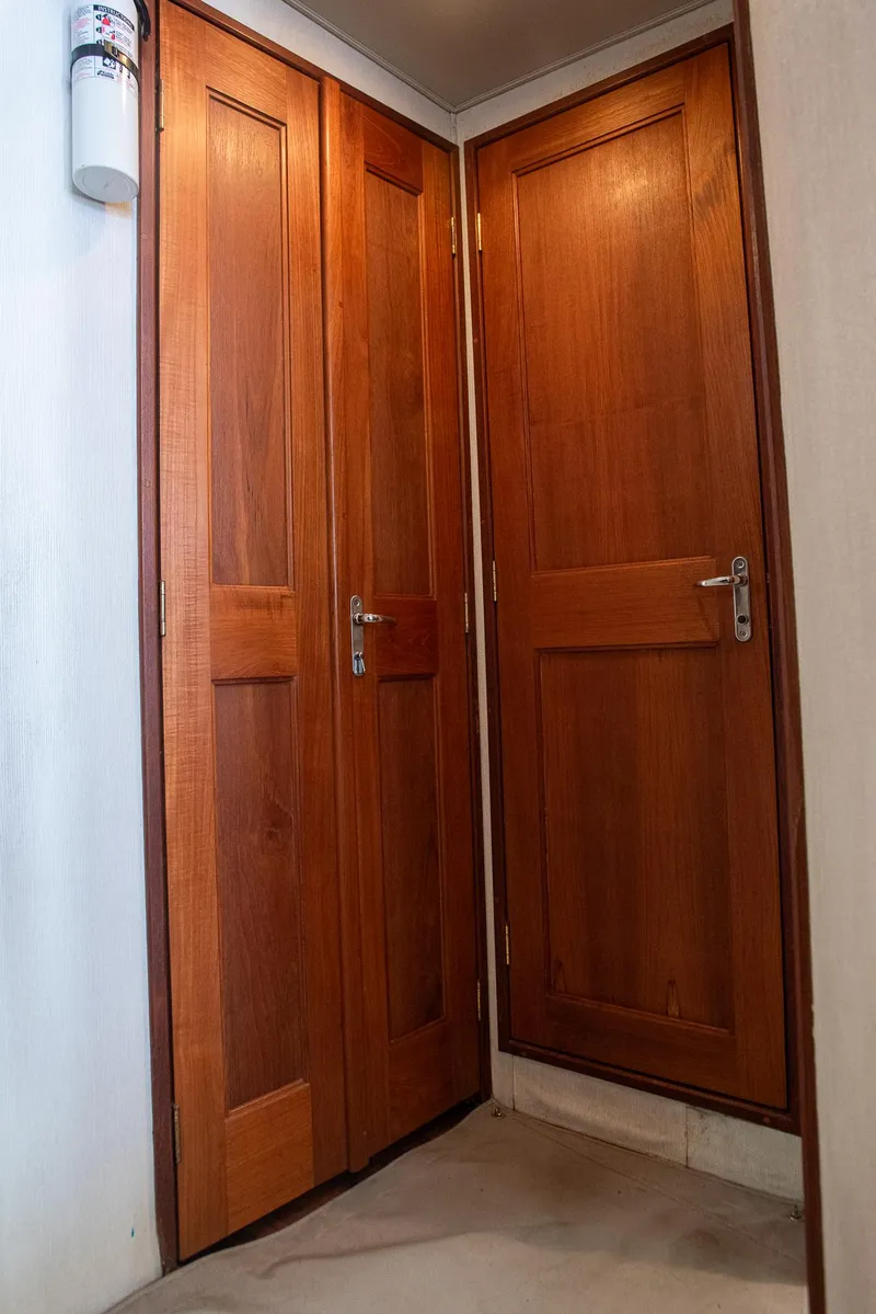 Slide: The Image of Wooden doors inside a 1989 Viking 57 yacht, featuring classic design and polished finish. - 39