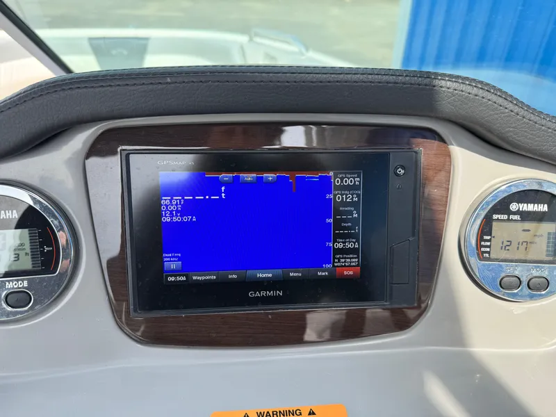 Slide: The Image of Dashboard of 2019 Chaparral 21 H2O Sport OB with Garmin display and Yamaha gauges. - 10