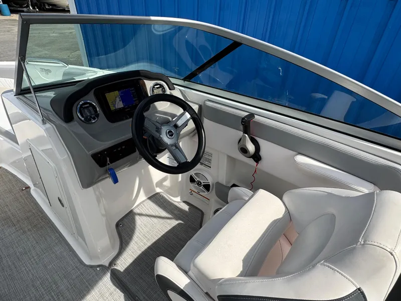 Slide: The Image of 2019 Chaparral 21 H2O Sport OB boat interior with steering wheel and dashboard. - 14