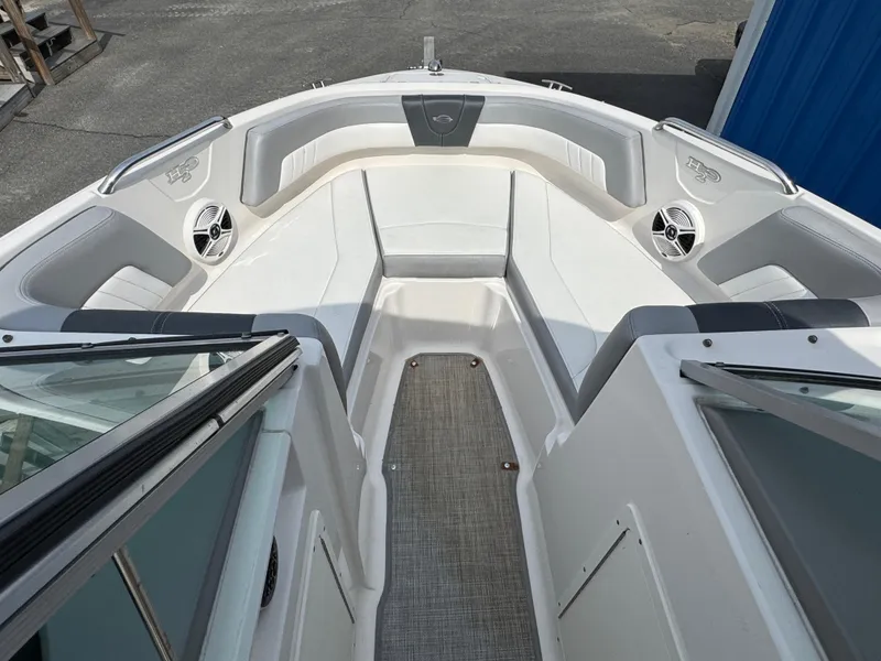 Slide: The Image of 2019 Chaparral 21 H2O Sport OB boat interior with seating and speakers. - 20