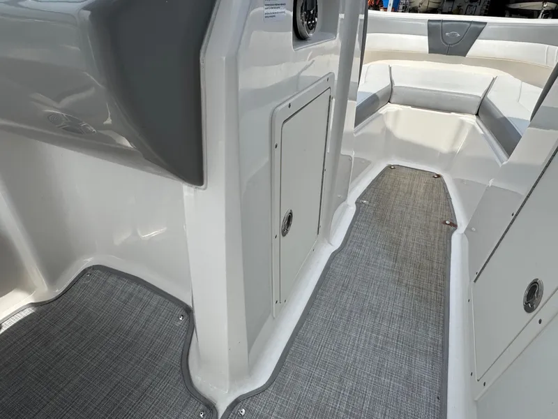 Slide: The Image of 2019 Chaparral 21 H2O Sport OB interior with gray flooring and seating. - 22