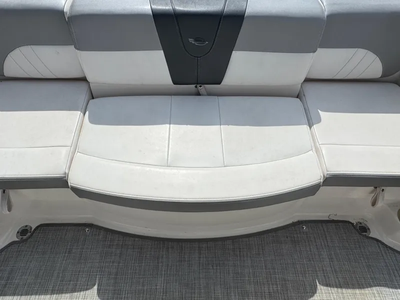 Slide: The Image of 2019 Chaparral 21 H2O Sport OB boat seating, featuring gray and white upholstery. - 26