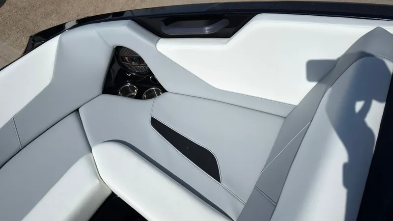 Slide: The Image of Interior of 2025 MasterCraft NXT20 with modern white upholstery. - 32