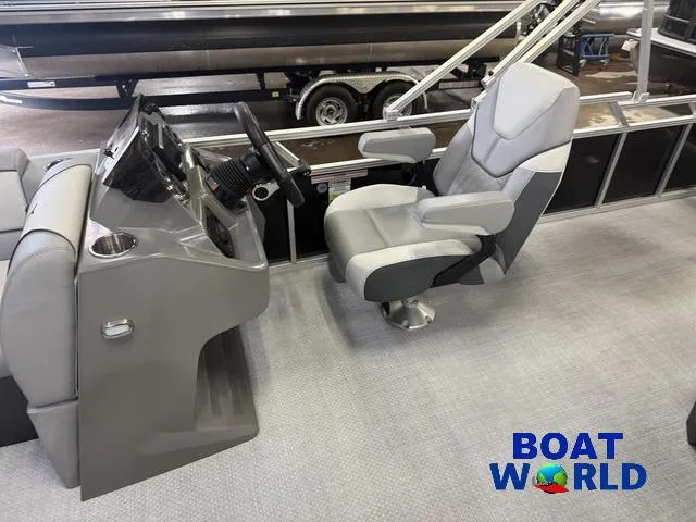 Slide: The Image of 2025 Tahoe Sport 2185 boat interior with captain's chair and control panel. - 11