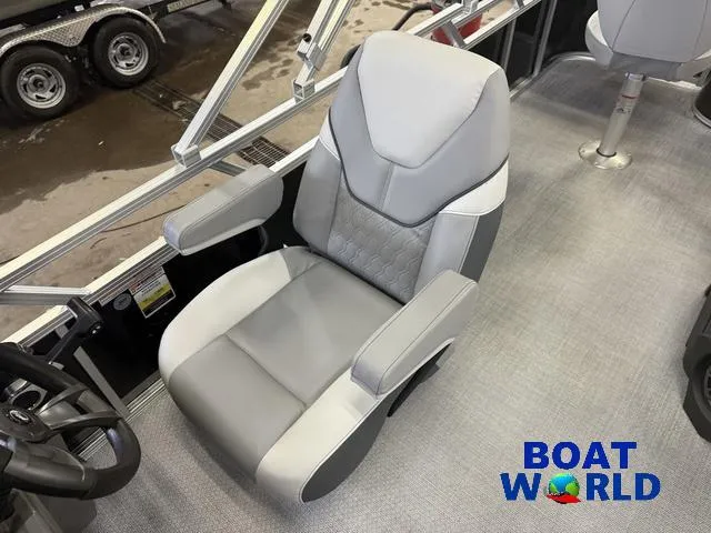 Slide: The Image of 2025 Tahoe Sport 2185 boat seat, gray upholstery, armrests, Boat World logo. - 12