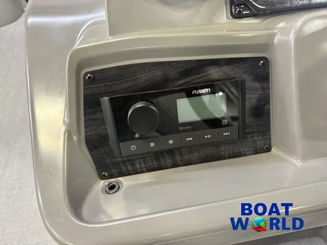 Slide: The Image of Control panel of 2025 Tahoe Sport 2185 Rear Fish boat with Fusion audio system. - 15