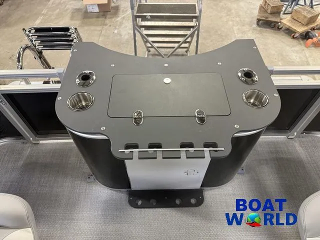 Slide: The Image of 2025 Tahoe Sport 2185 Rear Fish boat interior with fishing station and cup holders. - 19