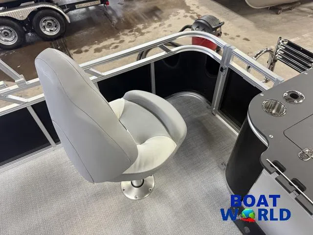 Slide: The Image of 2025 Tahoe Sport 2185 boat interior with swivel seat and control panel. - 20