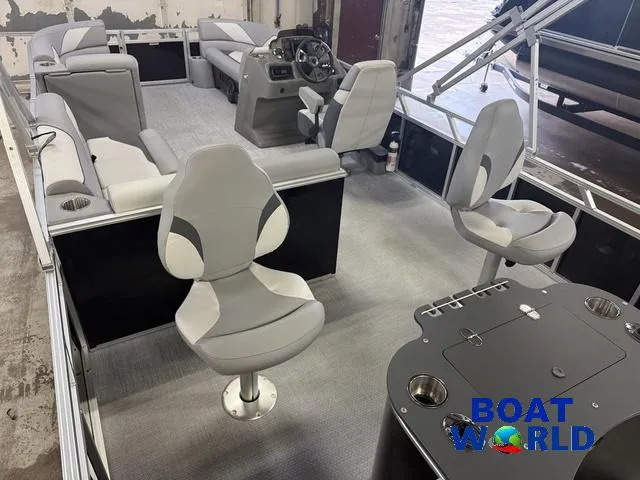 Slide: The Image of 2025 Tahoe Sport 2185 Rear Fish boat interior with seating and steering console. - 21