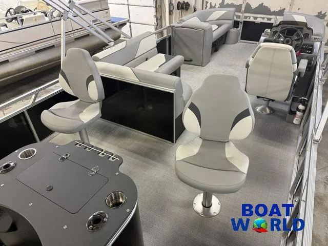 Slide: The Image of 2025 Tahoe Sport 2185 Rear Fish boat interior with modern seating and fishing setup. - 22